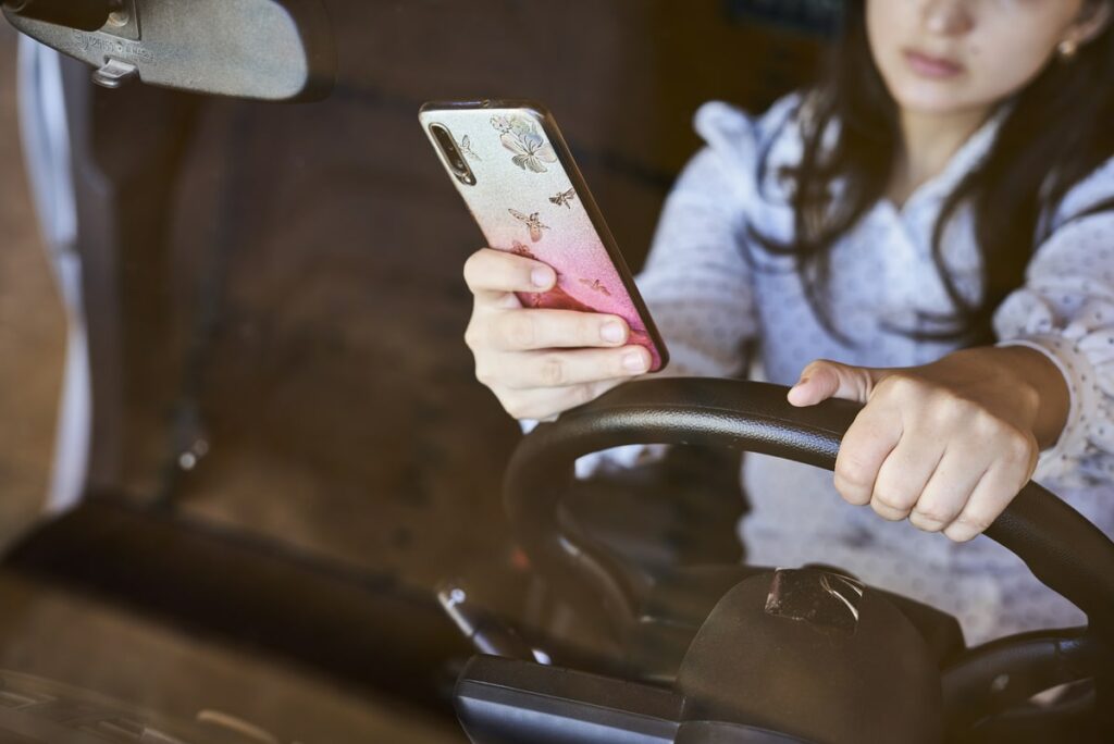 Women texting and driving